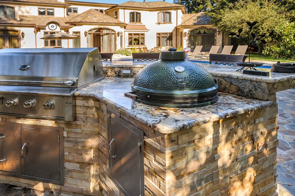 Inspiration for a large timeless backyard stone patio kitchen remodel in San Francisco with no cover