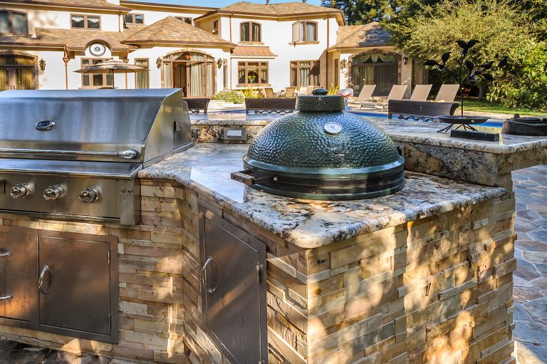Inspiration for a large timeless backyard stone patio kitchen remodel in San Francisco with no cover