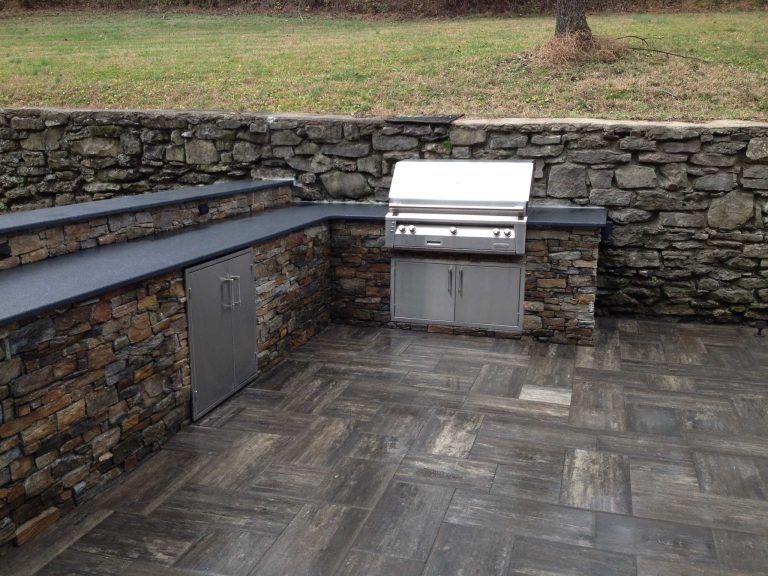 Inspiration for a large timeless backyard tile patio kitchen remodel in Nashville with no cover