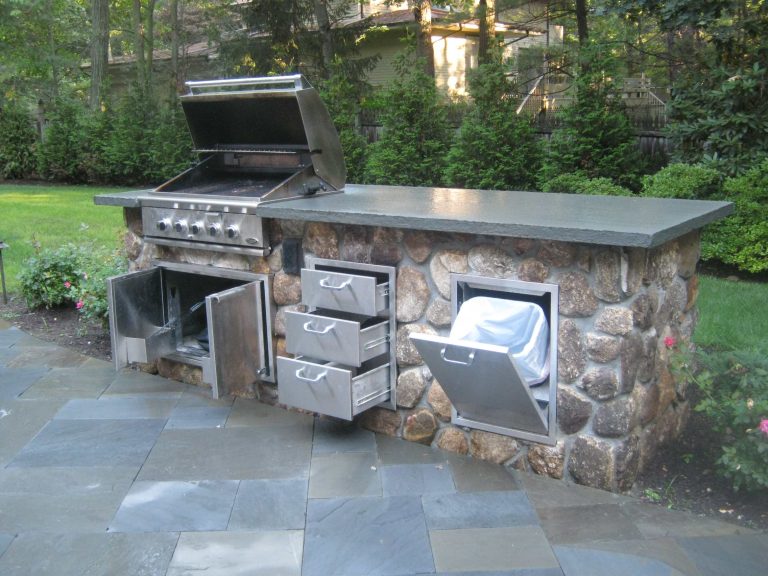 Inspiration for a large timeless backyard tile patio kitchen remodel in New York