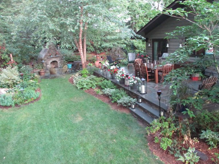 Inspiration for a large timeless backyard tile patio kitchen remodel in New York with no cover