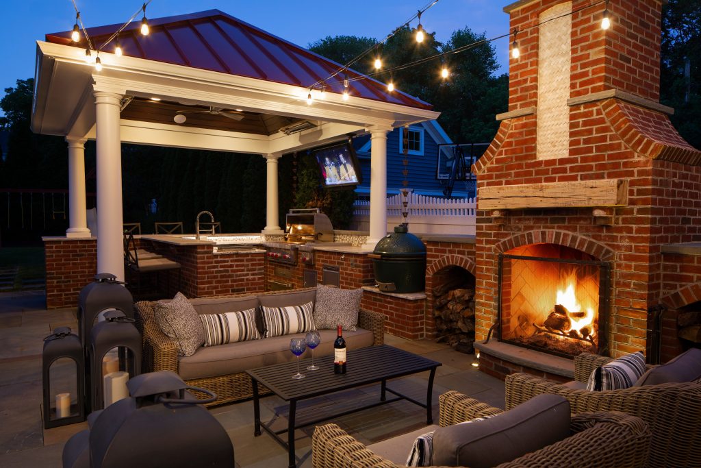 Inspiration for a large timeless backyard tile patio kitchen remodel in Philadelphia with a gazebo