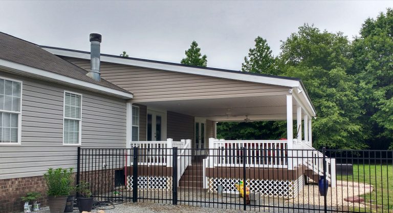 Inspiration for a large timeless brick front porch remodel in Other with a roof extension by Jones Fence & Custom Vinyl, LLC | Outdoor Photos | Porch | Landscaping | Landscape Design | Outdoor Living Space | Porch Design Ideas | Outdoor Living Space Ideas | Backyard Design