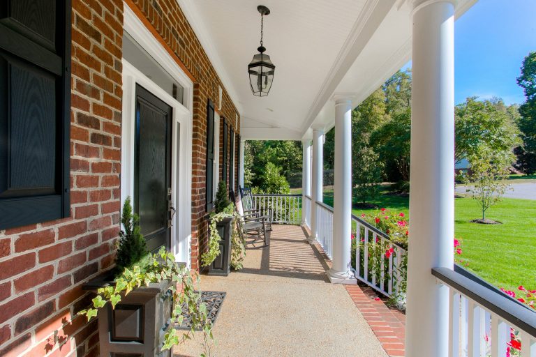 Inspiration for a large timeless concrete front porch remodel in Richmond with a roof extension by Colonial Homecrafters, Ltd. | Outdoor Photos | Porch | Landscaping | Landscape Design | Outdoor Living Space | Porch Design Ideas | Outdoor Living Space Ideas | Backyard Design