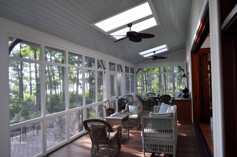 Inspiration for a large timeless screened-in back porch remodel in Atlanta with decking and a roof extension by Frederick + Frederick Architects | Outdoor Photos | Porch | Landscaping | Landscape Design | Outdoor Living Space | Porch Design Ideas | Outdoor Living Space Ideas | Backyard Design