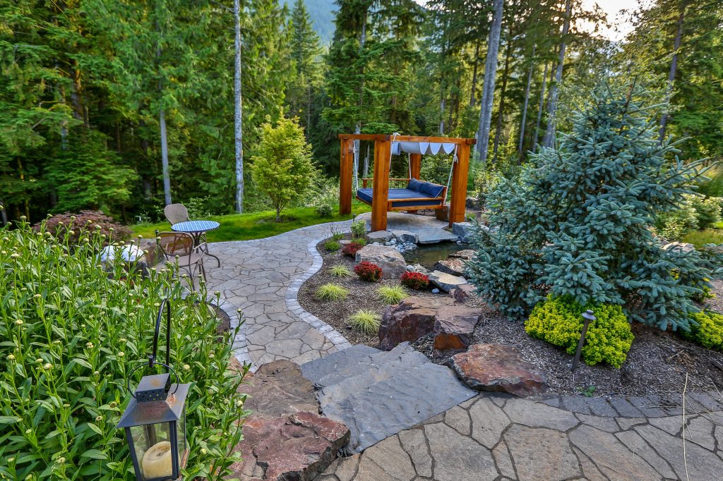 Inspiration for a large traditional backyard concrete paver garden path in Seattle.