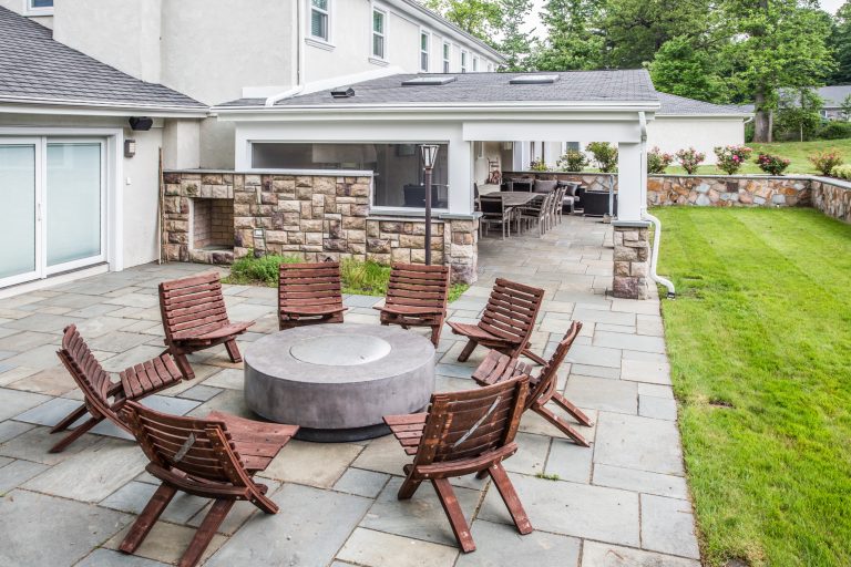 Inspiration for a large transitional backyard concrete paver patio kitchen remodel in New York with no cover