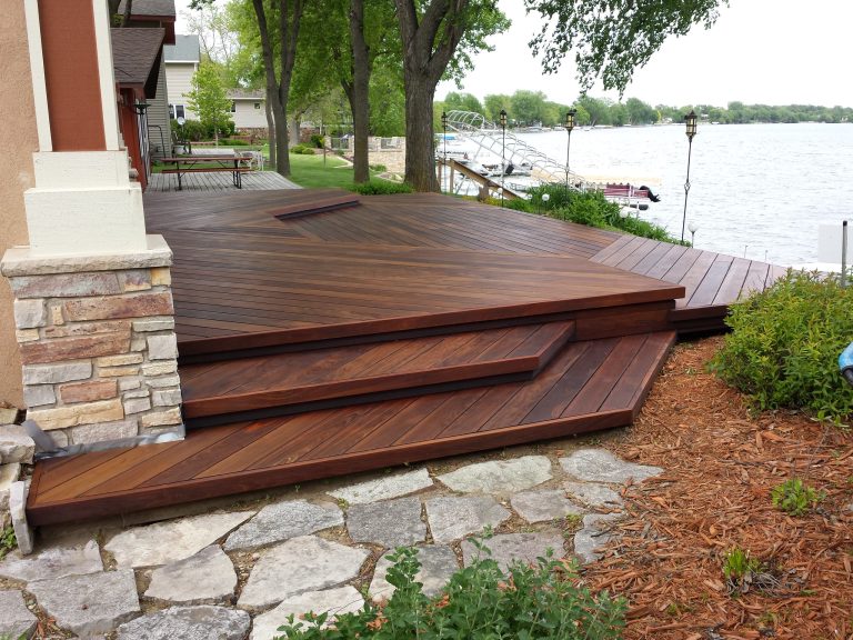 Inspiration for a large transitional backyard deck remodel in Minneapolis with no cover