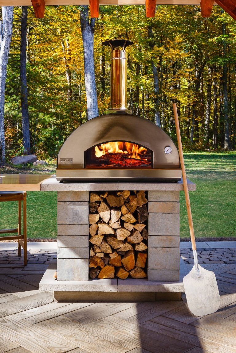 Inspiration for a large transitional backyard patio kitchen remodel in Minneapolis with decking and a pergola