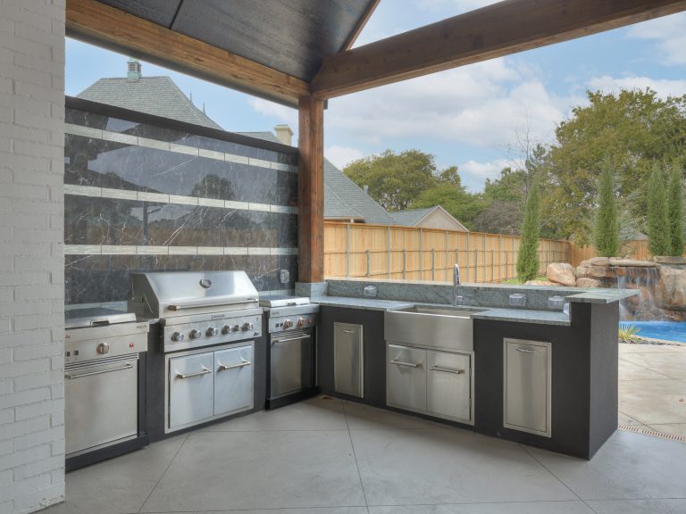 Inspiration for a large transitional backyard patio kitchen remodel in Oklahoma City with a roof extension