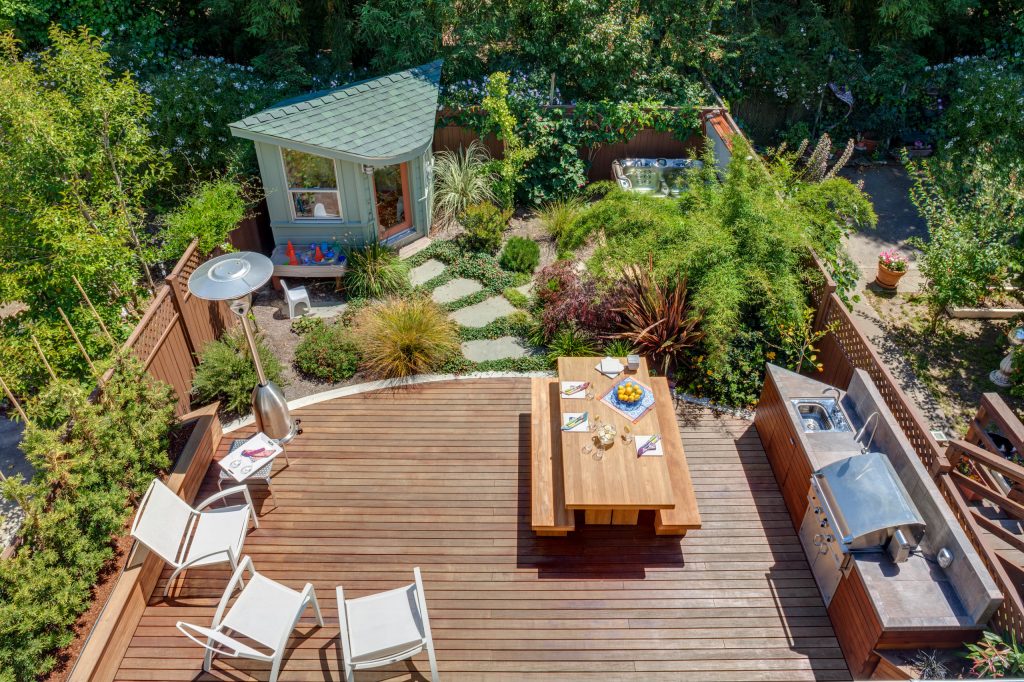 Inspiration for a large transitional backyard patio kitchen remodel in San Francisco with decking and no cover