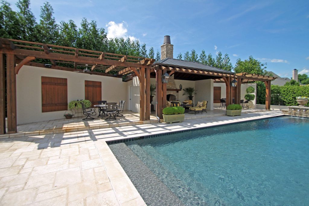 Inspiration for a large transitional backyard stone and rectangular lap pool house remodel in Other