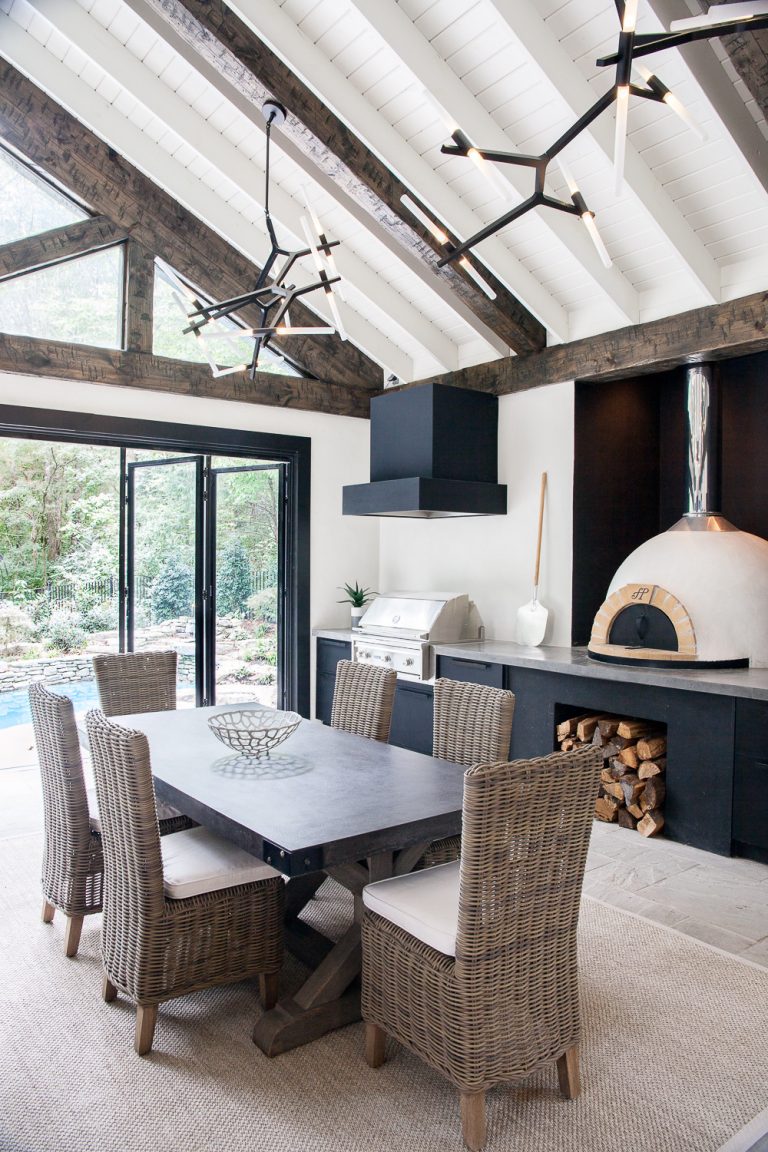 Inspiration for a large transitional backyard stone patio kitchen remodel in Nashville with a roof extension