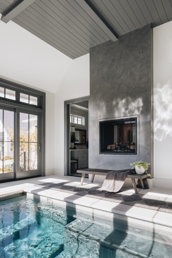 Inspiration for a large transitional indoor concrete paver and rectangular pool remodel in Chicago