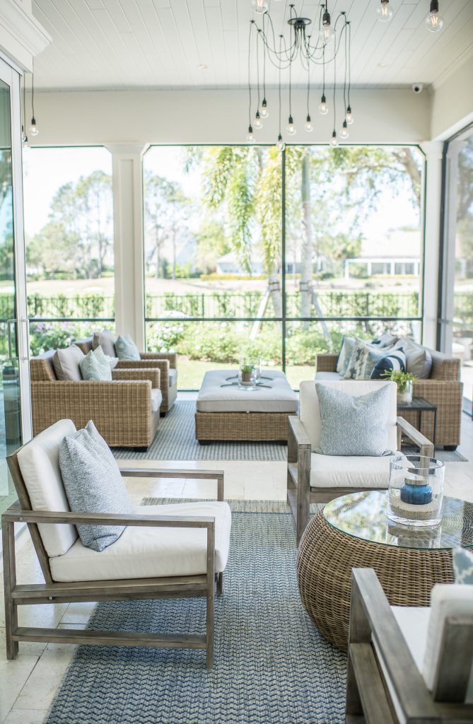 Inspiration for a large transitional stone screened-in back porch remodel in Orlando with a roof extension by Ashley Martin Home | Outdoor Photos | Porch | Landscaping | Landscape Design | Outdoor Living Space | Porch Design Ideas | Outdoor Living Space Ideas | Backyard Design