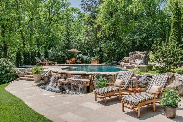 Inspiration for a mediterranean backyard kidney-shaped pool fountain remodel in Nashville