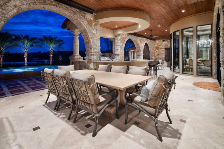 Inspiration for a mediterranean backyard patio kitchen remodel in Houston with a roof extension