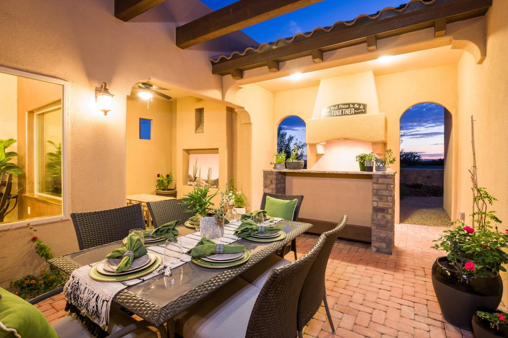 Inspiration for a mediterranean courtyard brick patio kitchen remodel in Austin with a pergola