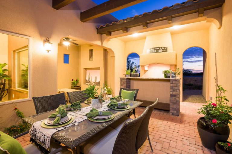 Inspiration for a mediterranean courtyard brick patio kitchen remodel in Austin with a pergola