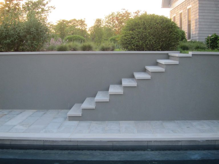Inspiration for a mid-sized asian backyard stone and rectangular pool remodel in New York