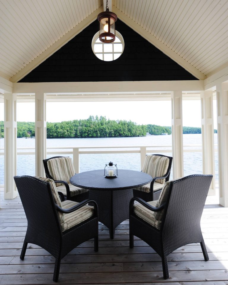 Inspiration for a mid-sized coastal backyard deck remodel in Other with a roof extension