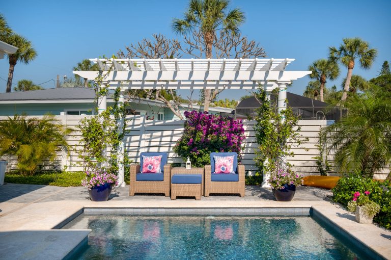 Inspiration for a mid-sized coastal backyard stone and rectangular lap pool remodel in Tampa