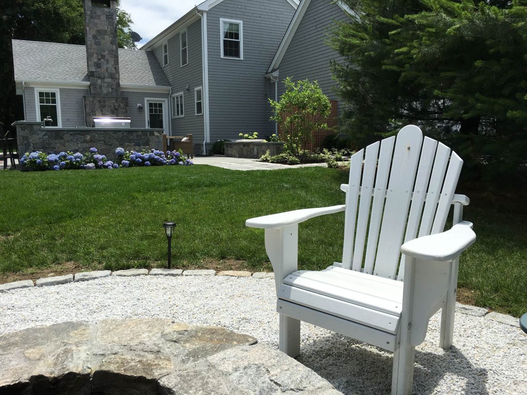 Inspiration for a mid-sized coastal concrete porch remodel in Providence