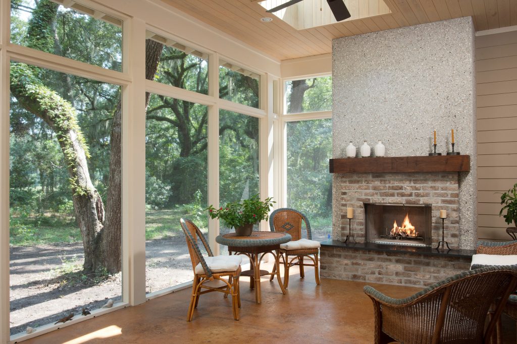 Inspiration for a mid-sized coastal porch remodel in Charleston with a fire pit by Court Atkins Group | Outdoor Photos | Porch | Landscaping | Landscape Design | Outdoor Living Space | Porch Design Ideas | Outdoor Living Space Ideas | Backyard Design