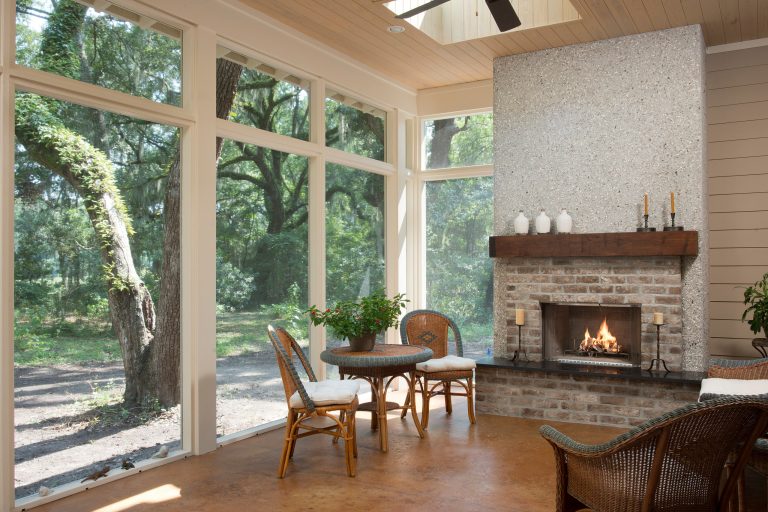 Inspiration for a mid-sized coastal porch remodel in Charleston with a fire pit by Court Atkins Group | Outdoor Photos | Porch | Landscaping | Landscape Design | Outdoor Living Space | Porch Design Ideas | Outdoor Living Space Ideas | Backyard Design