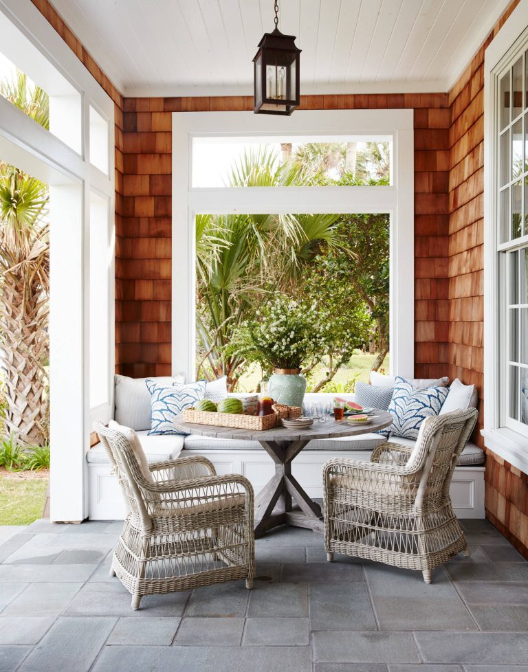 Inspiration for a mid-sized coastal stamped concrete side porch remodel in Jacksonville with a roof extension by Andrew Howard Interior Design | Outdoor Photos | Porch | Landscaping | Landscape Design | Outdoor Living Space | Porch Design Ideas | Outdoor Living Space Ideas | Backyard Design