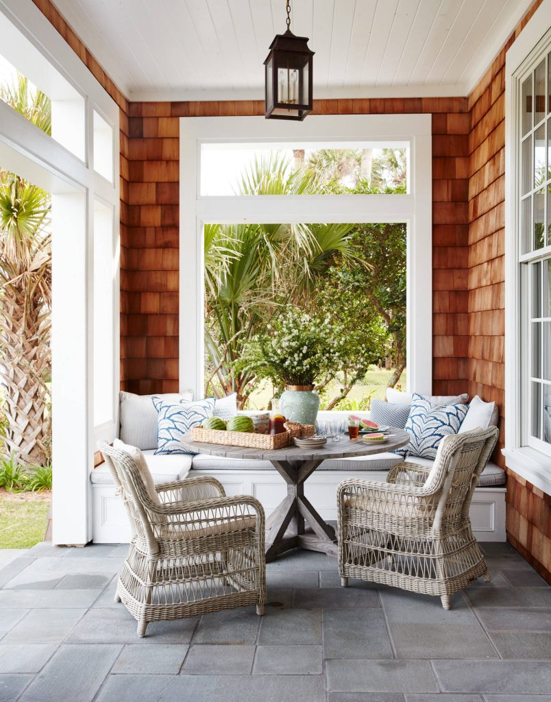 Inspiration for a mid-sized coastal stamped concrete side porch remodel in Jacksonville with a roof extension by Andrew Howard Interior Design | Outdoor Photos | Porch | Landscaping | Landscape Design | Outdoor Living Space | Porch Design Ideas | Outdoor Living Space Ideas | Backyard Design
