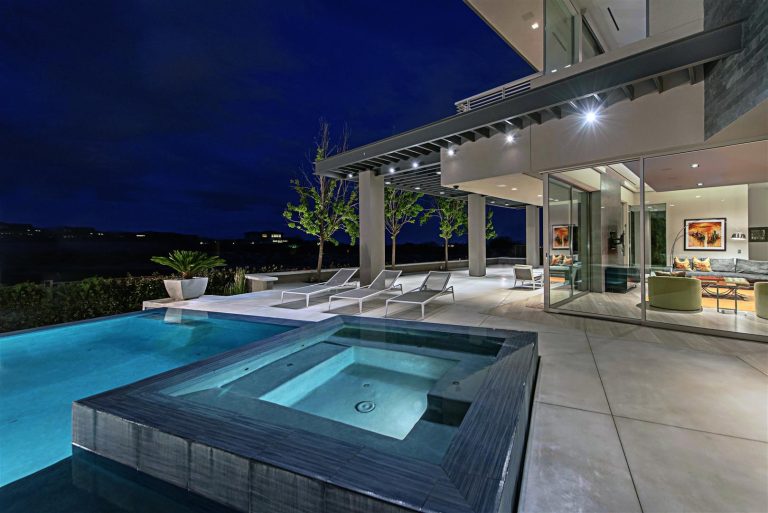 Inspiration for a mid-sized contemporary backyard concrete and rectangular infinity hot tub remodel in Las Vegas