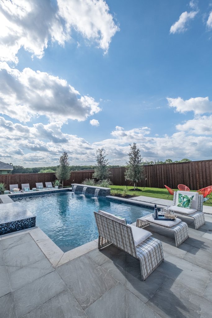 Inspiration for a mid-sized contemporary backyard concrete paver and rectangular hot tub remodel in Dallas