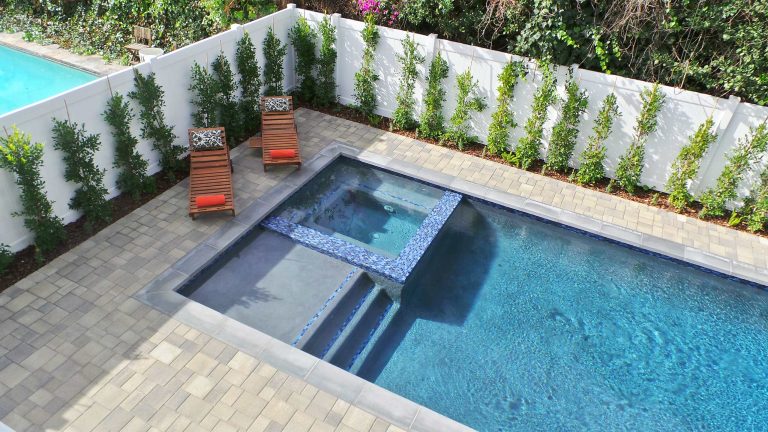 Inspiration for a mid-sized contemporary backyard concrete paver and rectangular hot tub remodel in Los Angeles