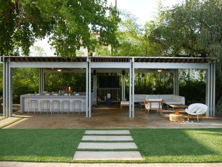 Inspiration for a mid-sized contemporary backyard concrete paver patio kitchen remodel in Miami with a pergola