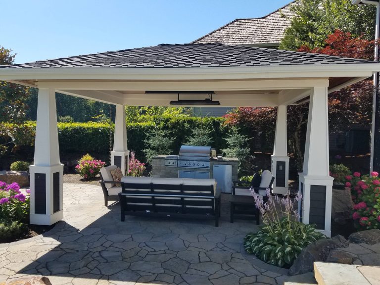 Inspiration for a mid-sized contemporary backyard concrete paver patio kitchen remodel in Seattle with a gazebo
