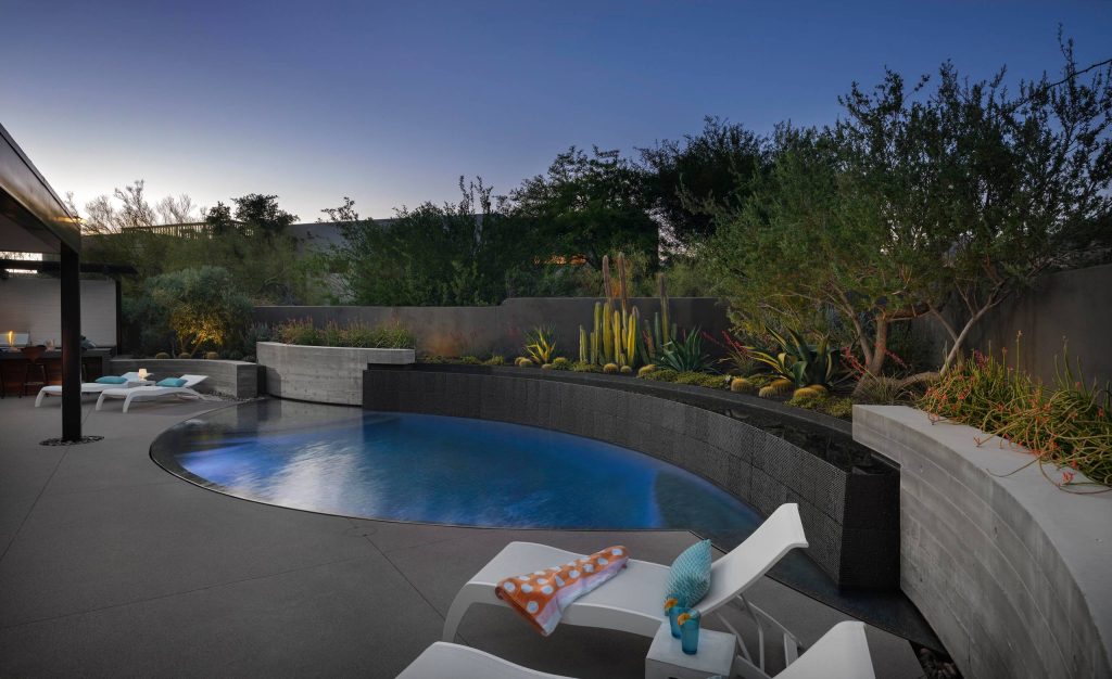 Inspiration for a mid-sized contemporary backyard concrete paver pool remodel in Phoenix