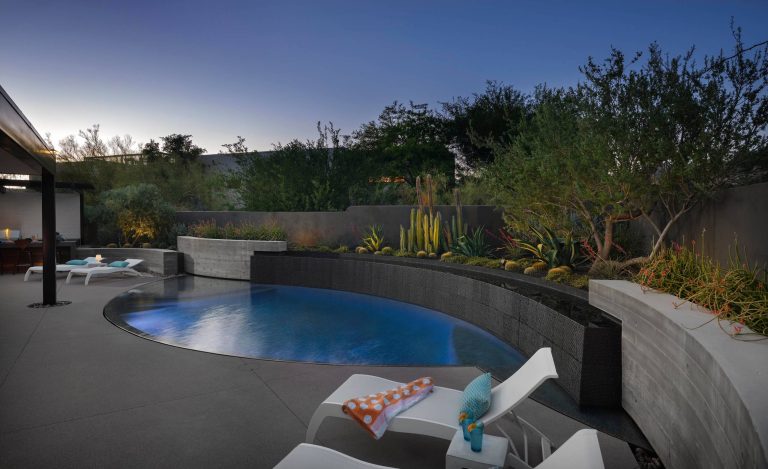 Inspiration for a mid-sized contemporary backyard concrete paver pool remodel in Phoenix