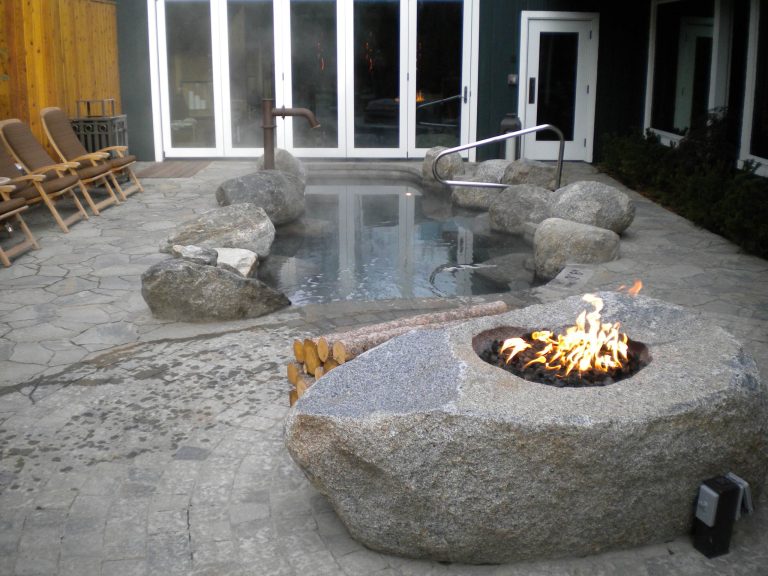 Inspiration for a mid-sized contemporary backyard stone and custom-shaped hot tub remodel in Boise