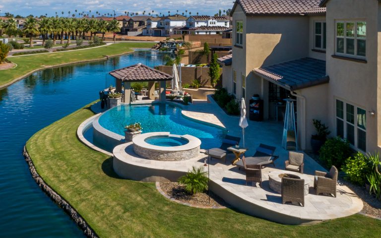 Inspiration for a mid-sized contemporary backyard tile and kidney-shaped infinity hot tub remodel in Phoenix