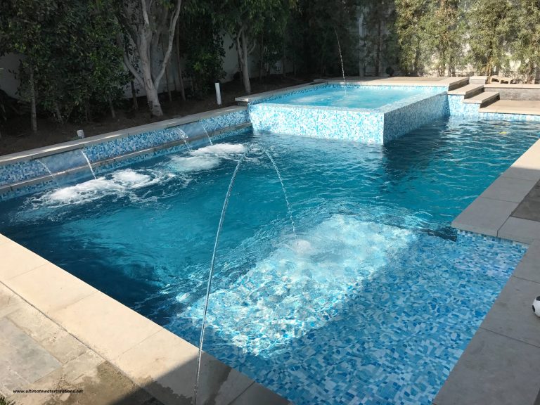 Inspiration for a mid-sized contemporary backyard tile and rectangular pool fountain remodel in Los Angeles