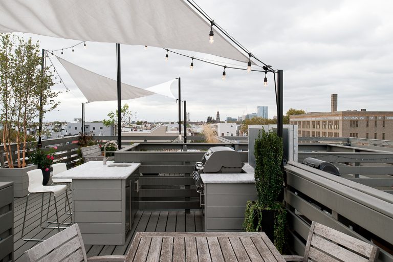 Inspiration for a mid-sized contemporary rooftop outdoor kitchen deck remodel in Philadelphia with an awning