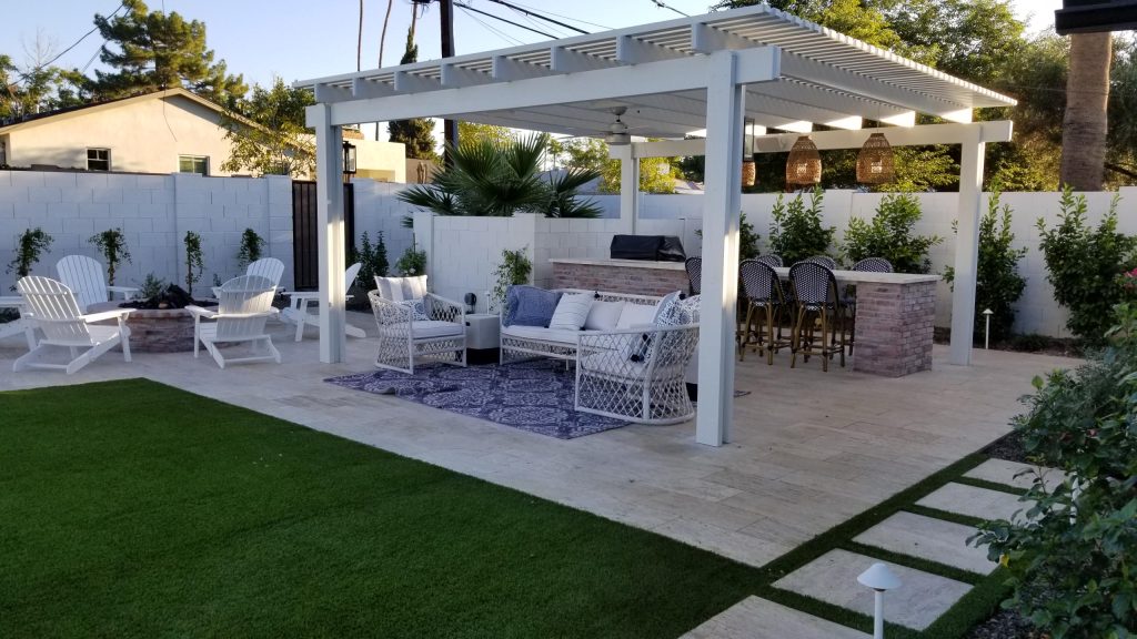 Inspiration for a mid-sized country backyard tile patio kitchen remodel in Phoenix with a pergola