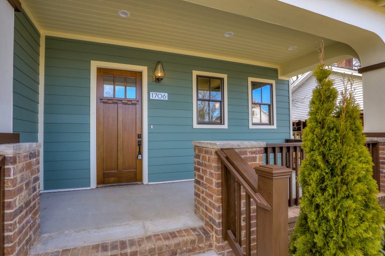 Inspiration for a mid-sized craftsman concrete front porch remodel in Nashville with a roof extension by Marcelle Guilbeau, Interior Designer | Outdoor Photos | Porch | Landscaping | Landscape Design | Outdoor Living Space | Porch Design Ideas | Outdoor Living Space Ideas | Backyard Design