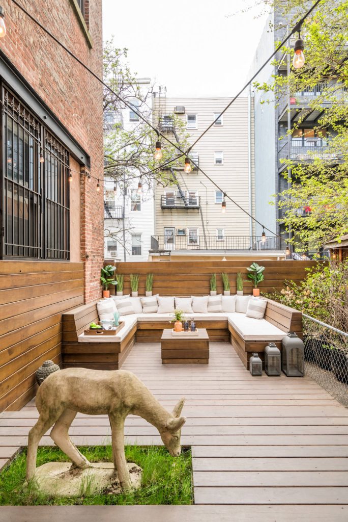 Inspiration for a mid-sized eclectic backyard deck remodel in New York with a fire pit and no cover