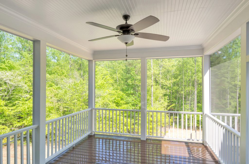 Inspiration for a mid-sized farmhouse screened-in back porch remodel in Other with decking and a roof extension by Dominion Custom Homes | Outdoor Photos | Porch | Landscaping | Landscape Design | Outdoor Living Space | Porch Design Ideas | Outdoor Living Space Ideas | Backyard Design