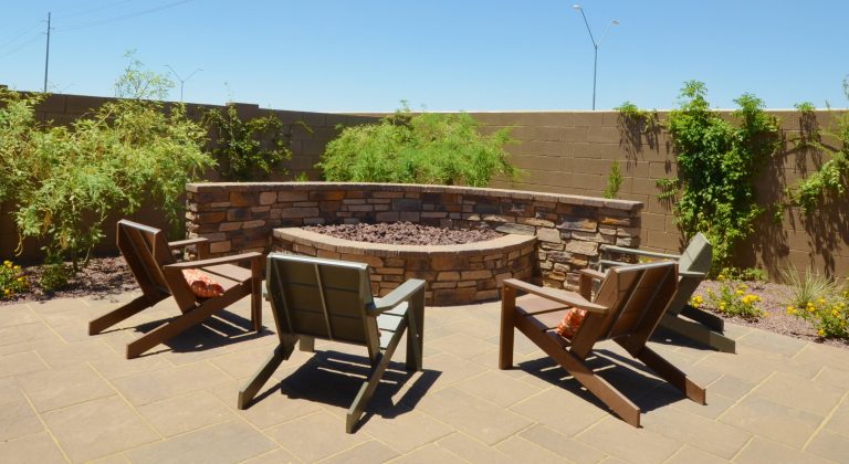 Inspiration for a mid-sized mediterranean backyard brick patio kitchen remodel in Phoenix