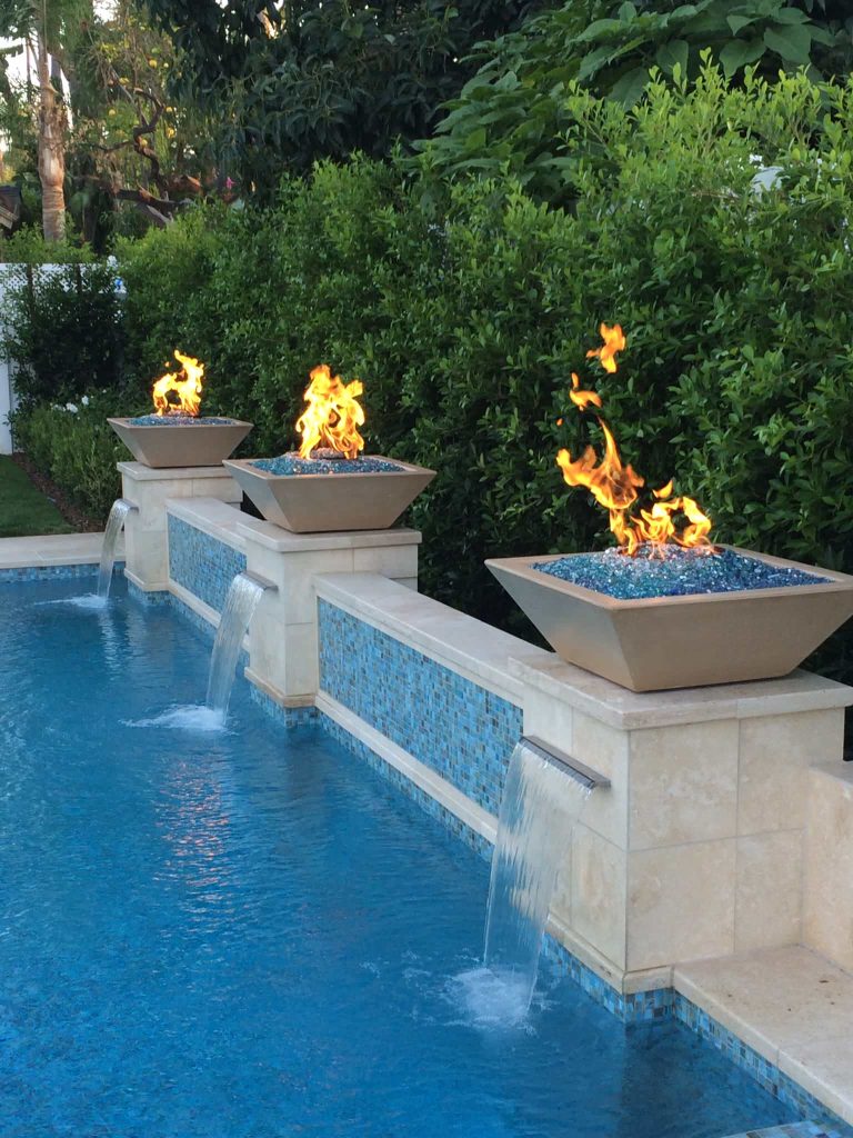 Inspiration for a mid-sized mediterranean backyard concrete and rectangular lap hot tub remodel in Los Angeles