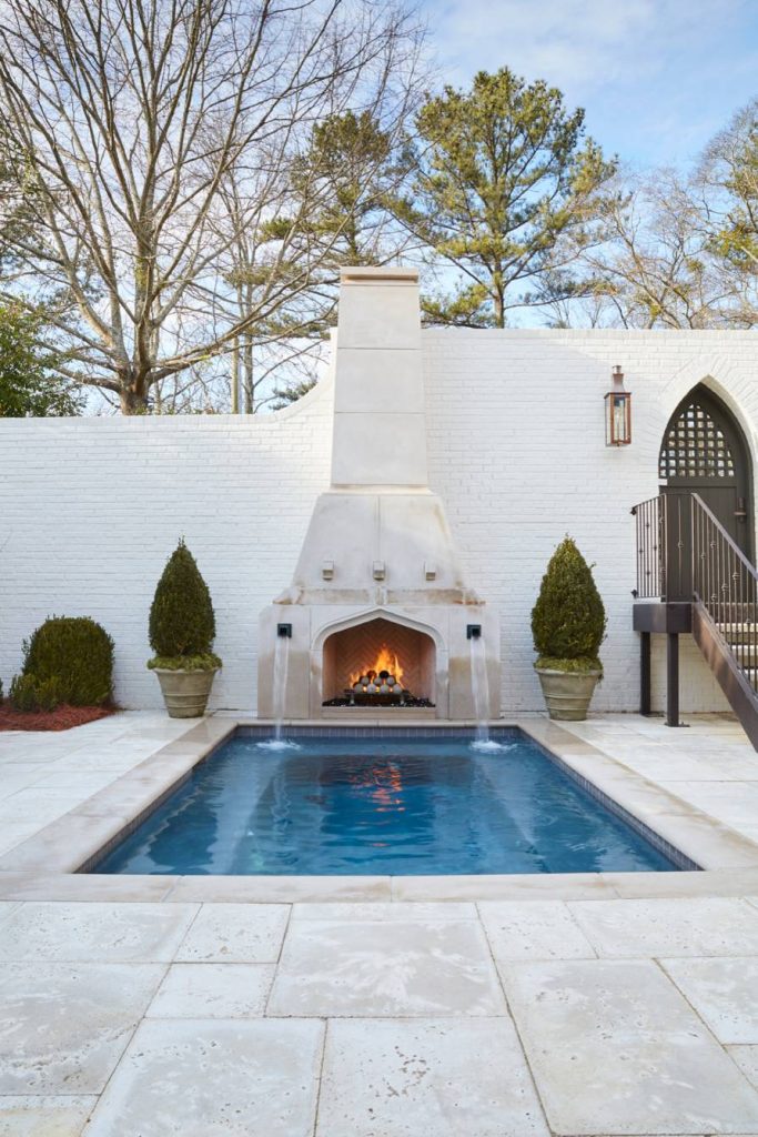 Inspiration for a mid-sized mediterranean backyard concrete paver and rectangular pool fountain remodel in Birmingham