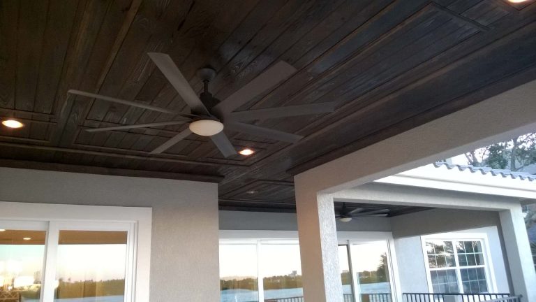 Inspiration for a mid-sized mediterranean tile porch remodel in Tampa with a roof extension